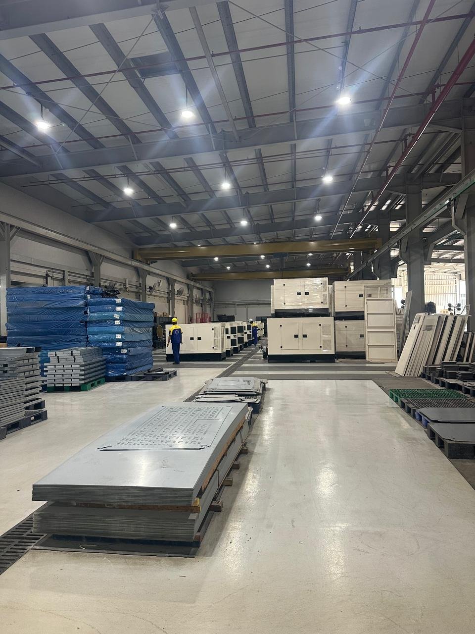 Fabrication floor — canopy base frames under the overhead crane