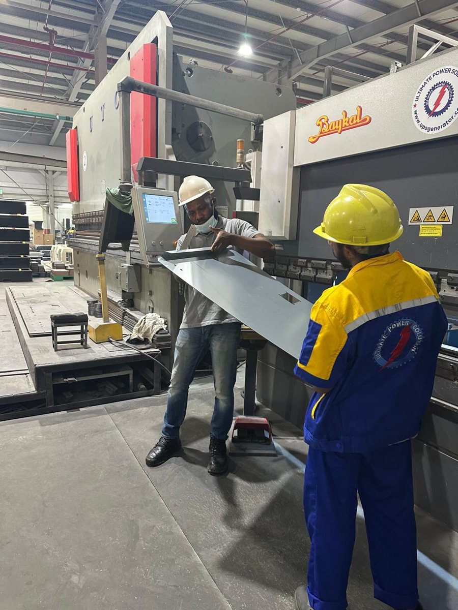 Checking a bent panel at the Baykal press brake